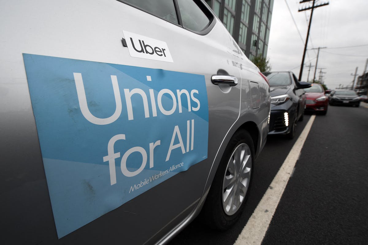 Uber car with Unions for all banner on the side